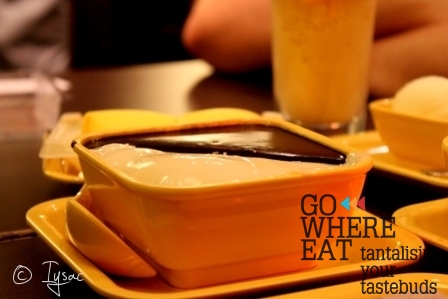 Tofu curd pudding mixed with black sesame sweet soup Tofu curd pudding mixed with black sesame sweet soup