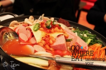 Big hot pot with sausages, hams, instant noodles and kim chi... Big hot pot with sausages, hams, instant noodles and kim chi...